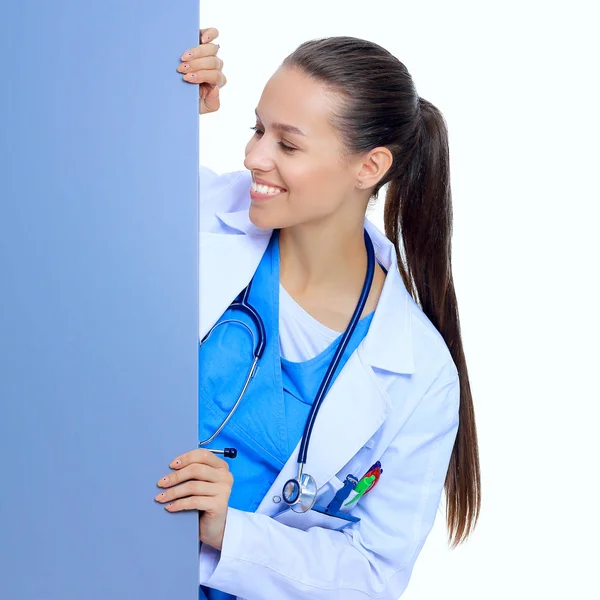 A female doctor with a blank billboard. — Stock Photo, Image