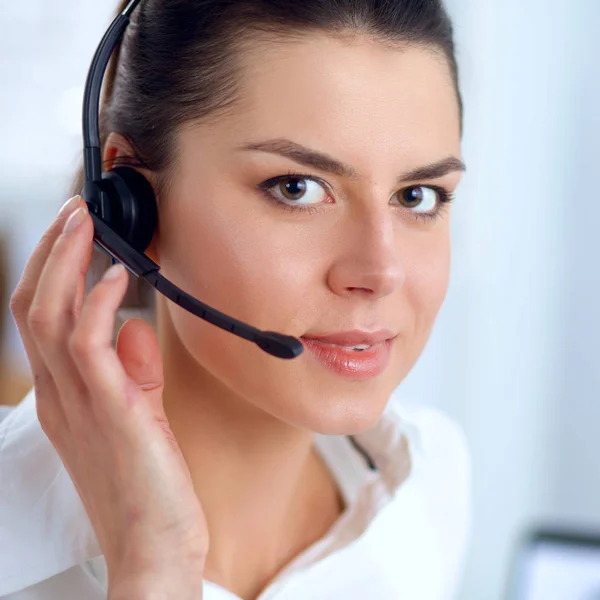 Close-up portrait of a customer service agent sitting at office Royalty Free Stock Images