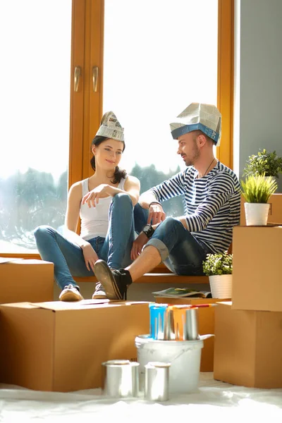 Couple moving in house sitting on the windowsill