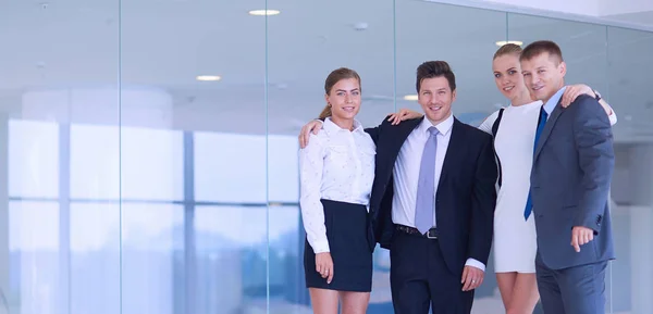 Smiling successful business team standing in office — Stock Photo, Image