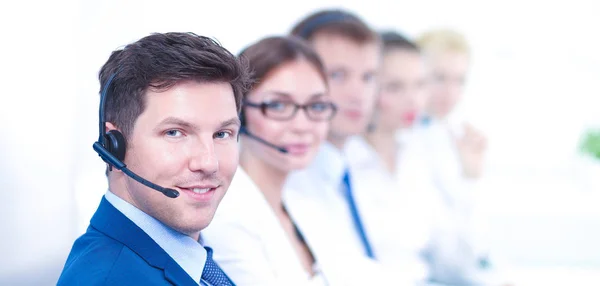 Attractive Smiling positive young businesspeople and colleagues in a call center office — Stock Photo, Image