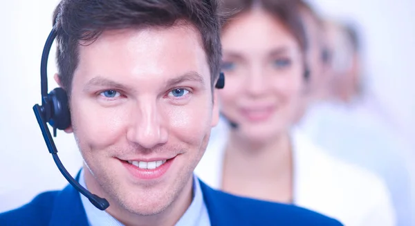 Attractive Smiling positive young businesspeople and colleagues in a call center office — Stock Photo, Image