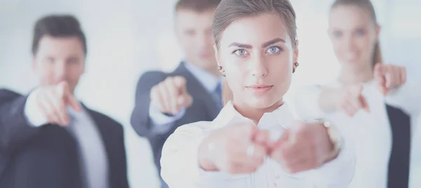 Group of business people pointing to you