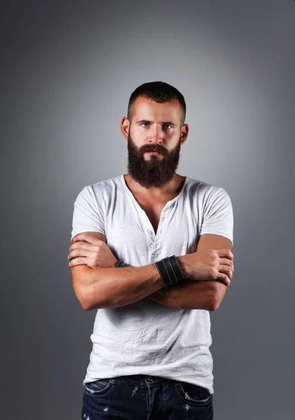 Portrait of handsome man standing, isolated on grey background — Stock Photo, Image