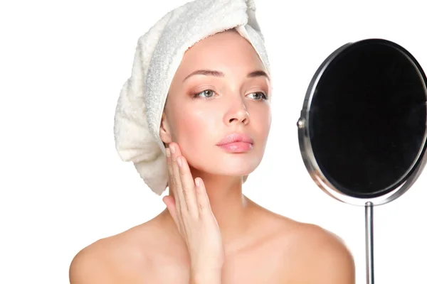 Portrait of beautiful girl touching her face with a towel on head — Stock Photo, Image