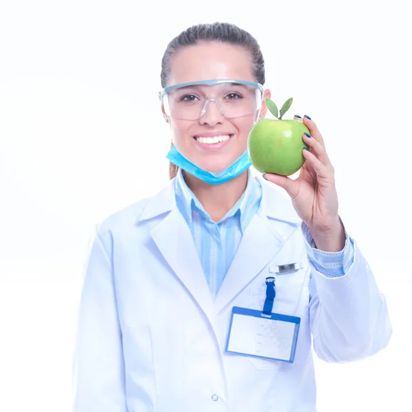 Mulher sorridente médico com uma maçã verde — Fotografia de Stock