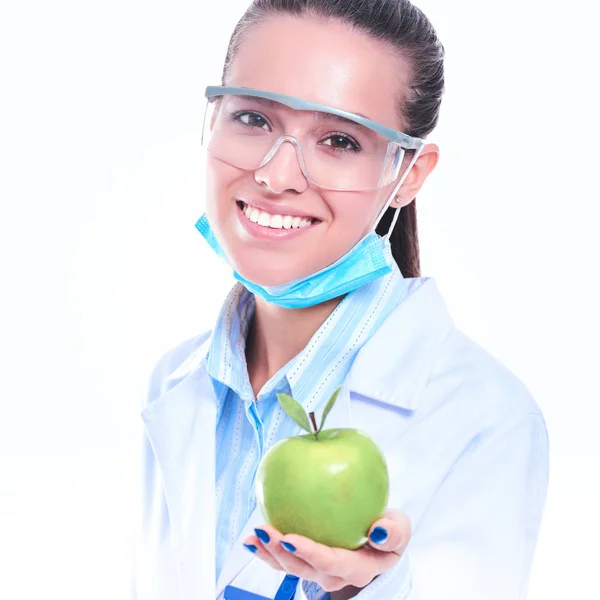 Mulher sorridente médico com uma maçã verde — Fotografia de Stock