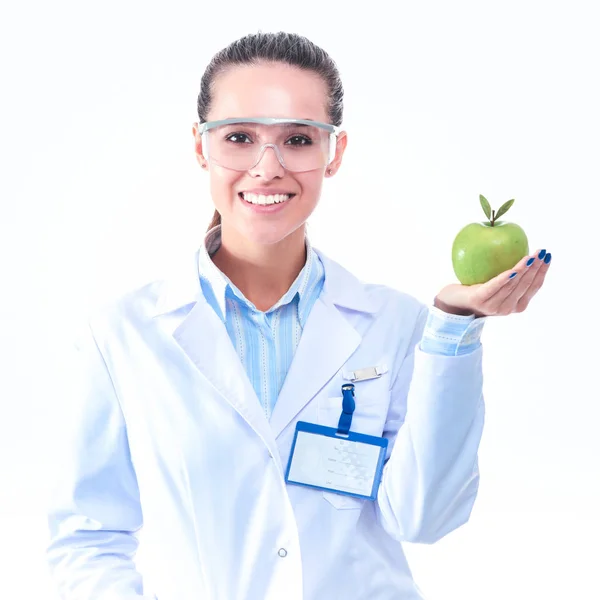 Mulher sorridente médico com uma maçã verde — Fotografia de Stock