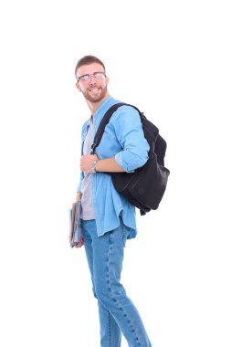 Okul çantası beyaz arka plan üzerinde izole kitap holding ile genç erkek öğrenci