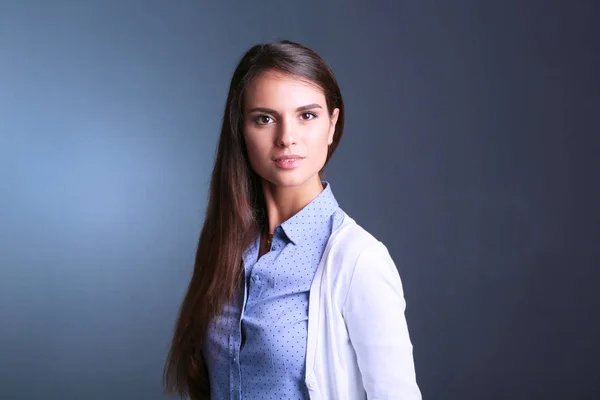 Portrait of a businesswoman , against dark background — Stock Photo, Image