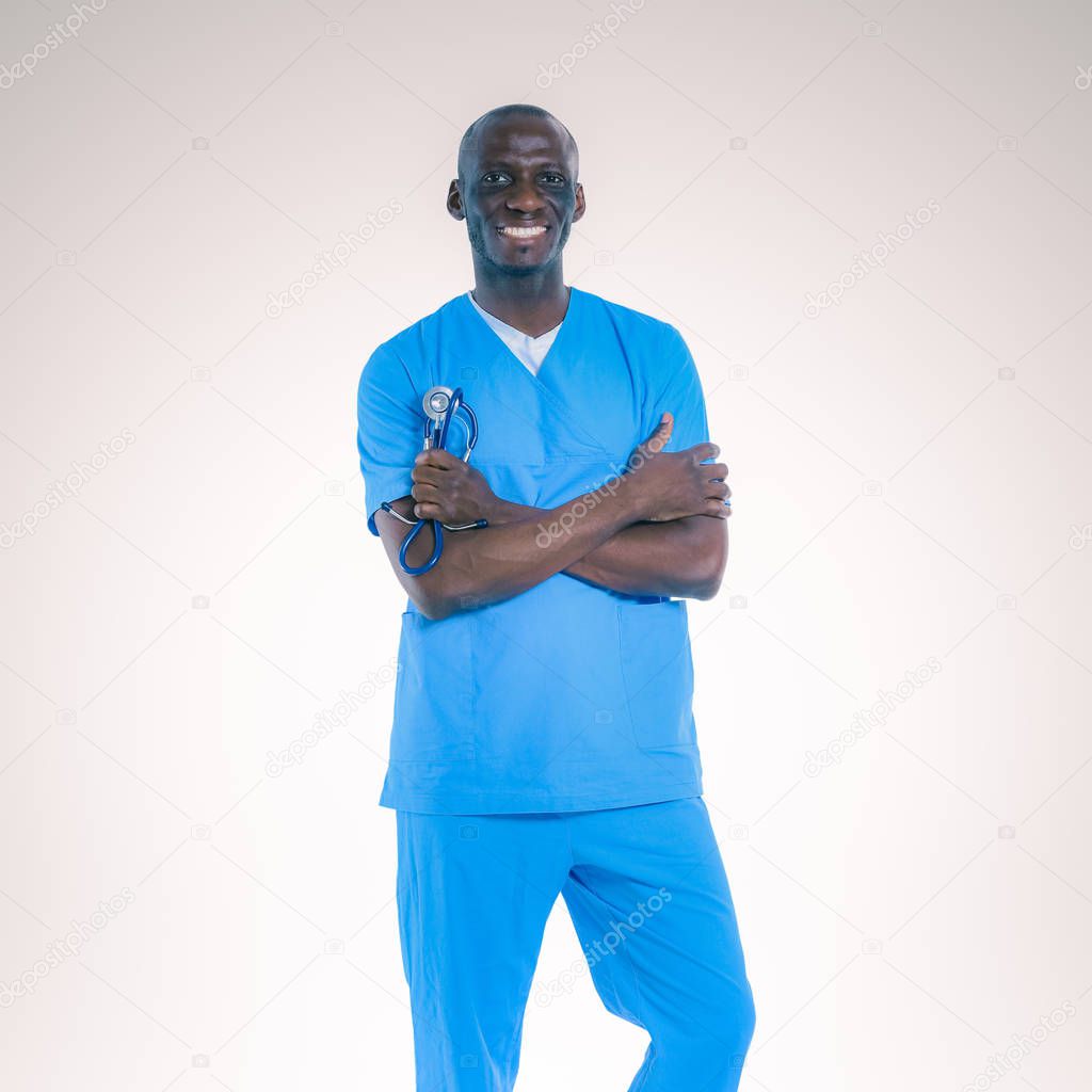 Portrait of a doctor man standing isolated on white background