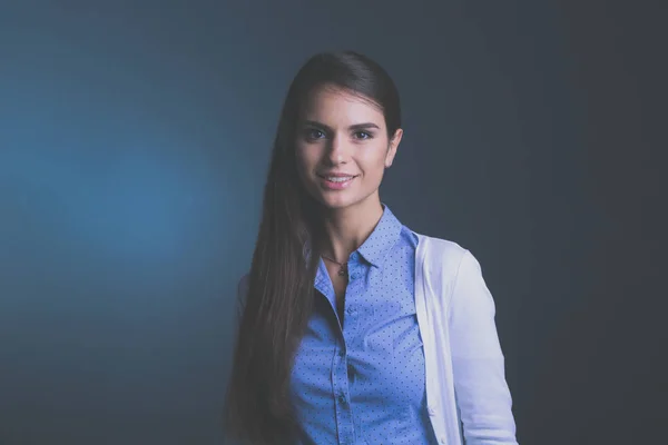 Portrait of a businesswoman , against dark background — Stock Photo, Image