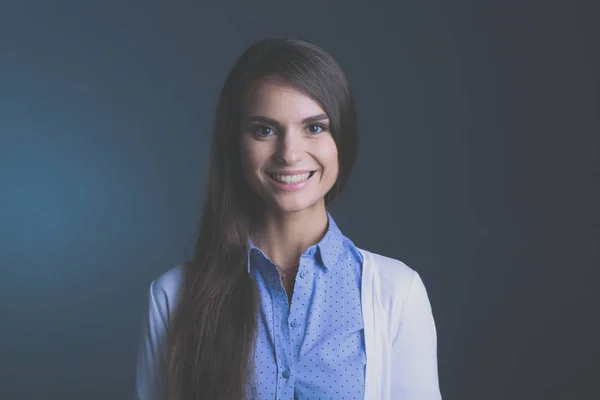 Portrait of a businesswoman , against dark background — Stock Photo, Image