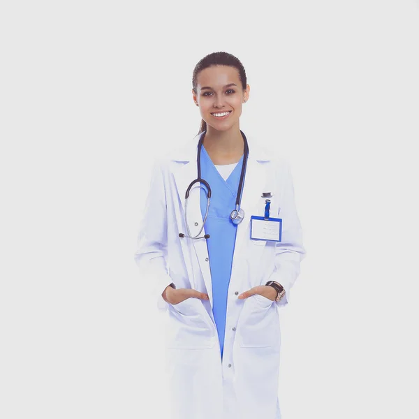 Beautiful young woman in white coat posing with hand in pocket. — Stock Photo, Image