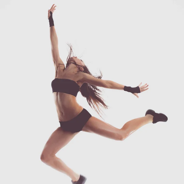 Elegante y joven bailarina de estilo moderno saltando — Foto de Stock