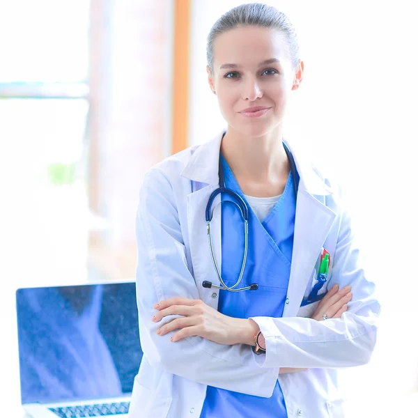 Woman doctor standing near window at hospital — Stock Photo, Image