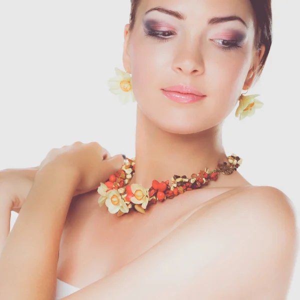 Portrait of young beautiful brunette woman in beads — Stock Photo, Image