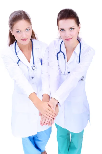 Doctors and nurses stacking hands. Isolated on white background — Stock Photo, Image