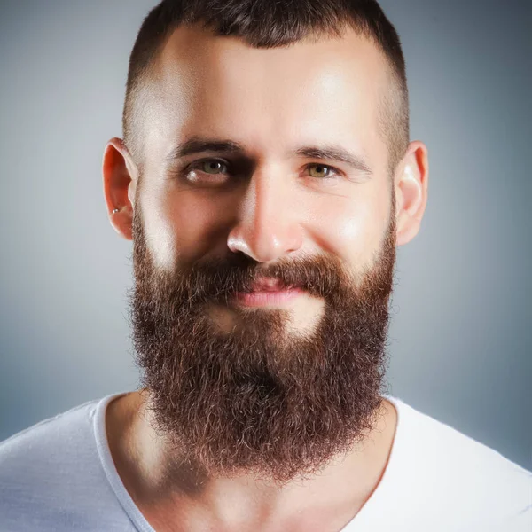 Portrait of handsome bearded man standing, isolated on grey bac — Stock Photo, Image