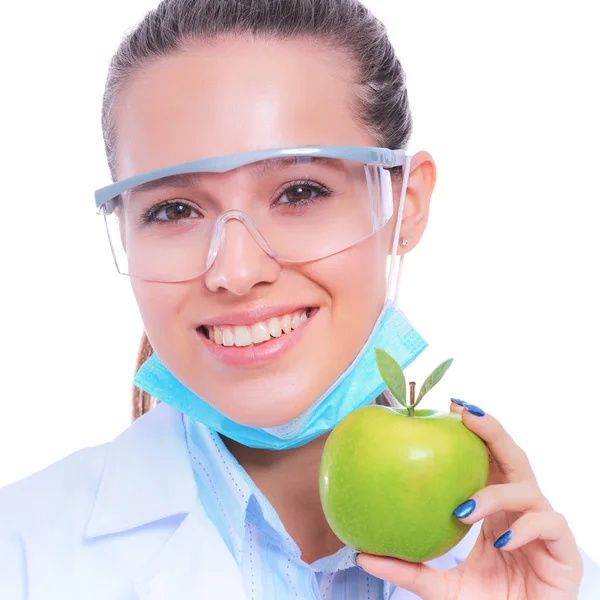 Mulher sorridente médico com uma maçã verde — Fotografia de Stock