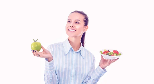 Portrait of a beautiful woman doctor holding a plate with fresh vegetables and green apple — Stock Photo, Image
