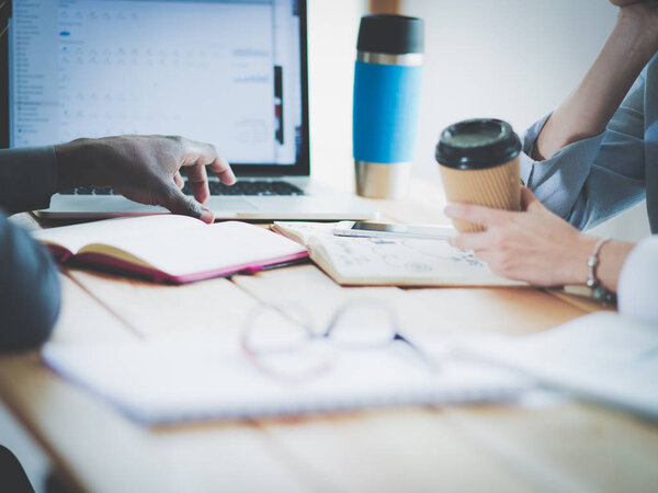 Business woman sitting in her office using a tablet computer. Business woman. Meeting