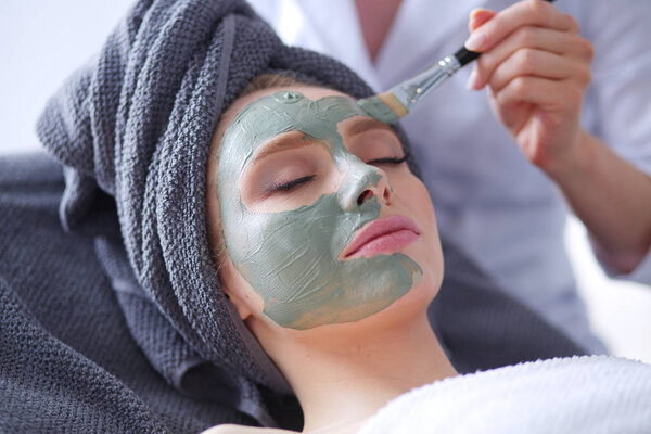 Beautiful woman having mask , lying on spa . Woman. Spa salon