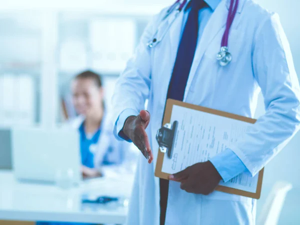 Male medicine doctor offering hand to shake in office closeup. Doctors — Stock Photo, Image