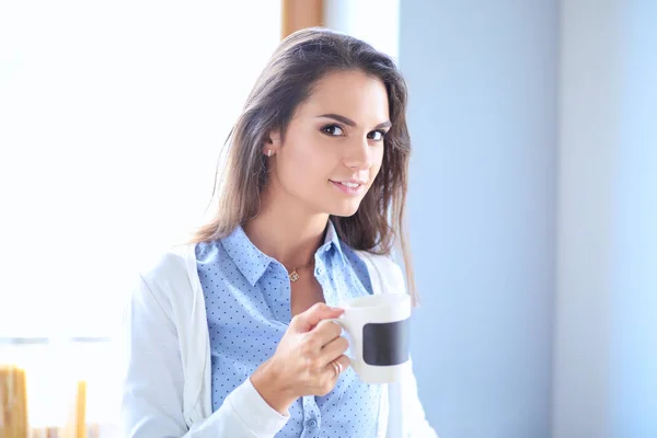 Happy woman drinking tea in the kitchen at home. Woman at home — Stock Photo, Image