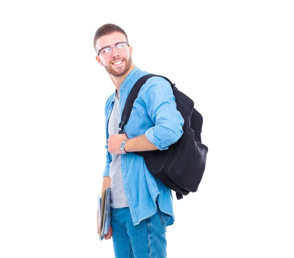 Un estudiante masculino con una bolsa de la escuela sosteniendo libros aislados sobre fondo blanco —  Fotos de Stock