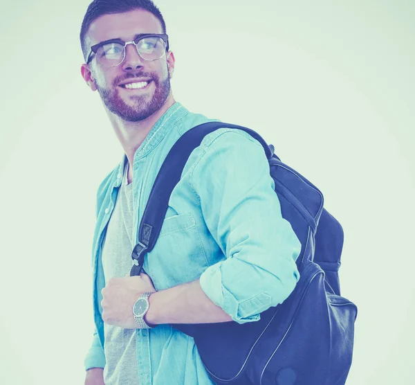 Uno studente maschio con una borsa della scuola che tiene libri isolati su sfondo bianco — Foto Stock