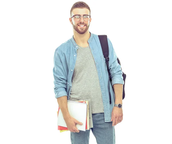 Mužský student s školní batoh drží knihy izolovaných na bílém pozadí — Stock fotografie