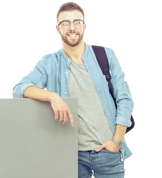 Retrato de um estudante do sexo masculino sorridente segurando placa em branco — Fotografia de Stock