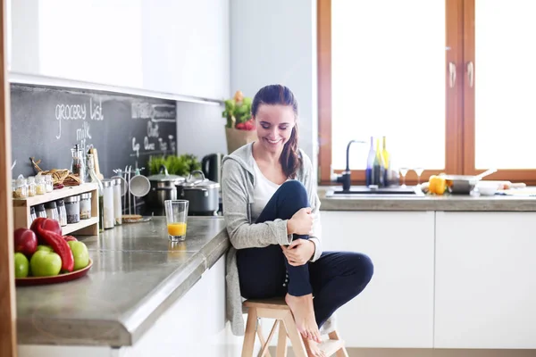 Woman in the kitchen. Cooking at kitchen.