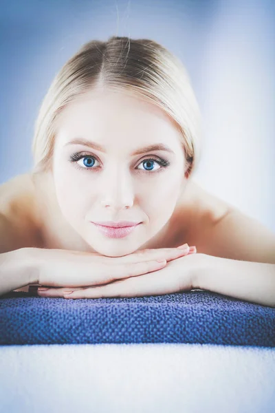 Young woman lying on a massage table,relaxing . Woman. Spa salon — Stock Photo, Image