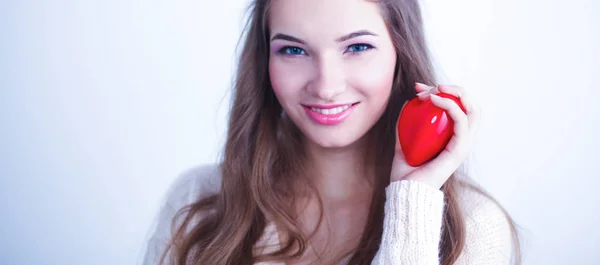 Portrait of beautiful happy woman holding a symbol heart. — Stock Photo, Image