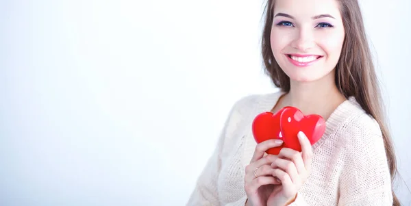 Portrait of beautiful happy woman holding a symbol heart. — Stock Photo, Image