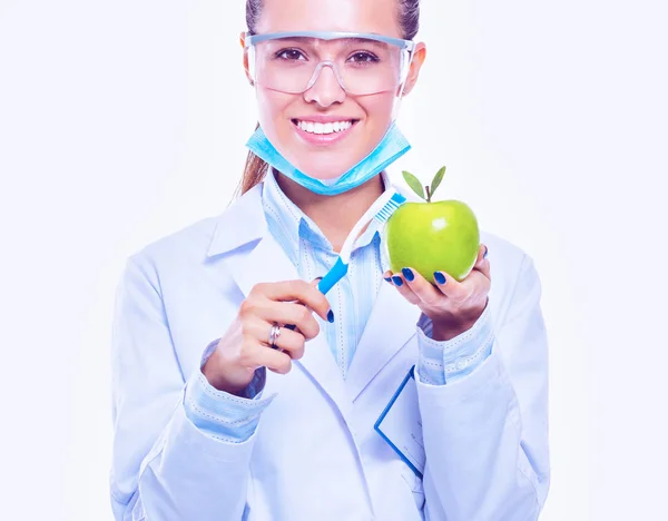 Dentist medical doctor woman hold green fresh apple in hand and tooth brush — Stock Photo, Image