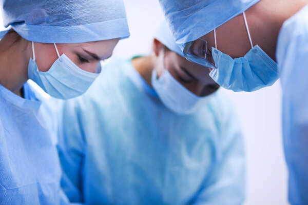 Team surgeon at work in operating room