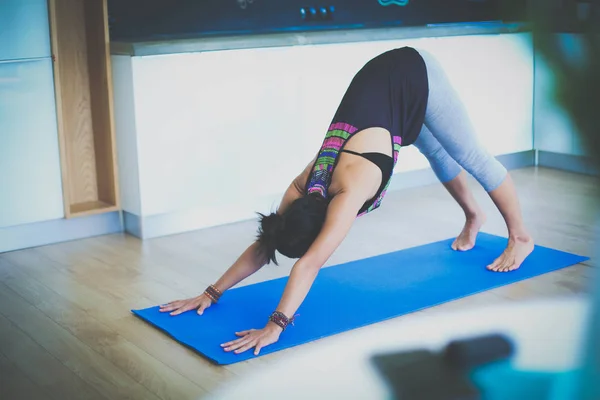 Asian woman are yoga exercises at home. Woman. Yoga.