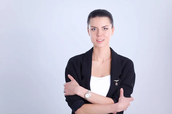 Young woman standing, isolated on gray background — Stock Photo, Image