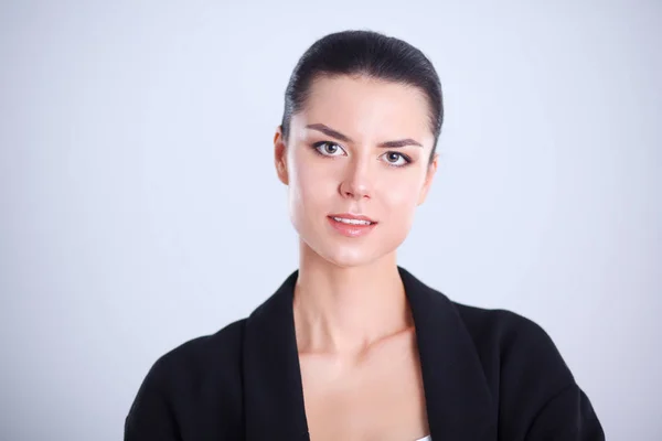 Young woman standing, isolated on gray background — Stock Photo, Image