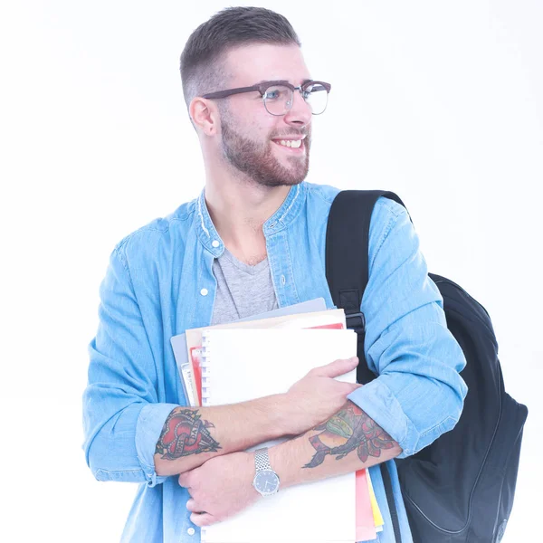 A male student with a school bag holding books isolated on white — Stock Photo, Image