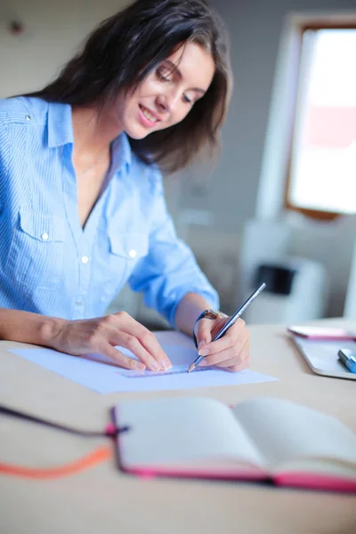 Young woman sitting at office table with laptop. Young woman. Laptop — Stock Photo, Image