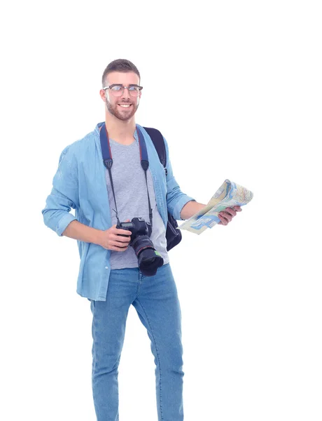Young man holding at map on white background. Young man holding a map on a white background. A tourist on vacations. Looking for sights. Adventures seeker. — Stock Photo, Image