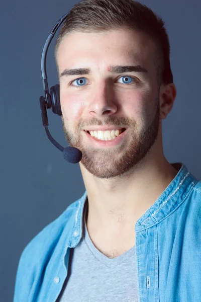 Portrait of young male with microphone. Call-center assistant. Help desk worker. — Stock Photo, Image