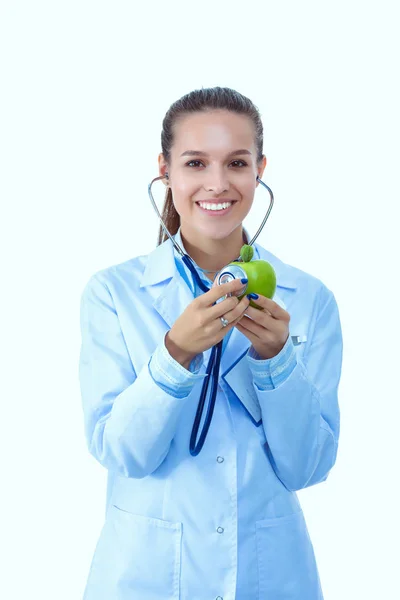 Medical doctor woman examining apple with stethoscope. Woman doctors — Stock Photo, Image