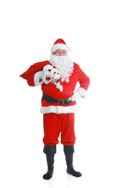 Real Papai Noel carregando grande saco cheio de presentes, isolado no fundo branco — Fotografia de Stock