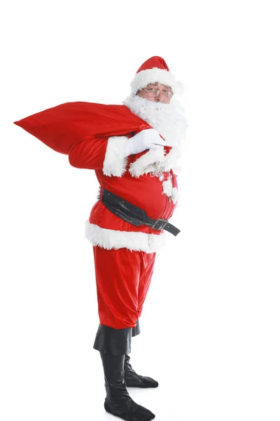 Echte santa claus grote draagtas vol geschenken, geïsoleerd op witte achtergrond — Stockfoto