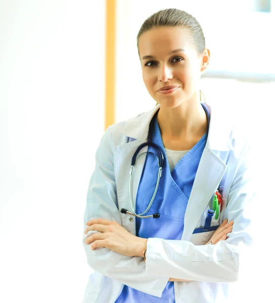 Woman doctor standing at hospital near window — Stock Photo, Image